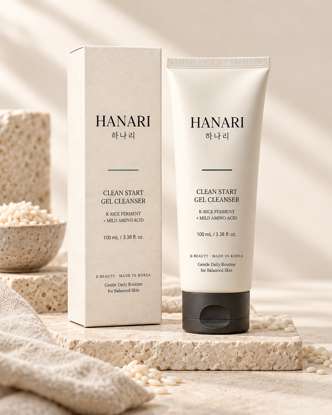 Concept render of the HANARI Clean Start Gel Cleanser tube and its carton on a stone slab.